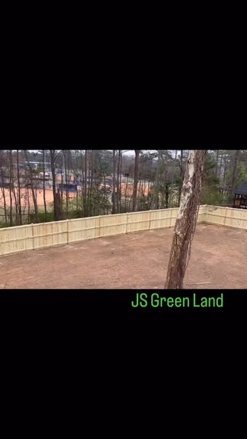 New wooden privacy fence around a large backyard